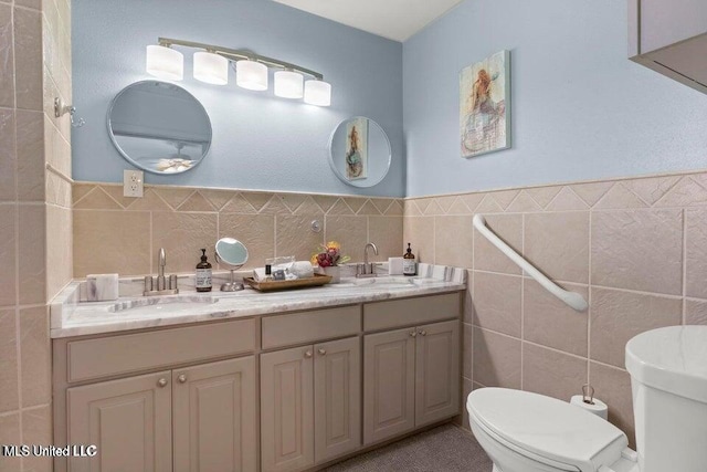 842 Deer Dr, Bay Saint Louis, MS 39520 - bathroom with tile walls, toilet, and double vanity