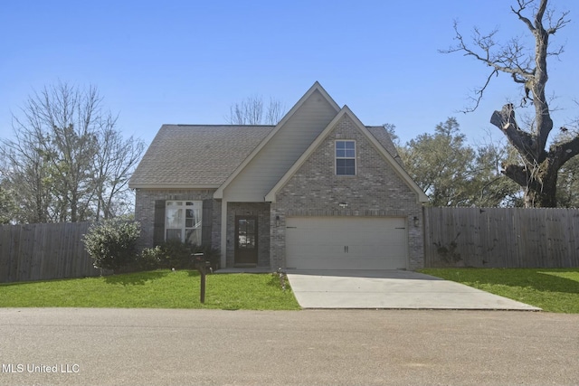 traditional-style house featuring concrete driveway, roof with shingles, fence, a front lawn, and brick siding