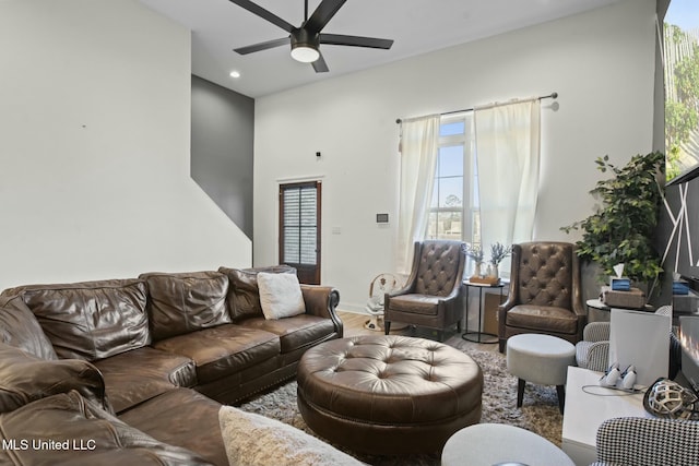 living area with wood finished floors, a ceiling fan, and recessed lighting