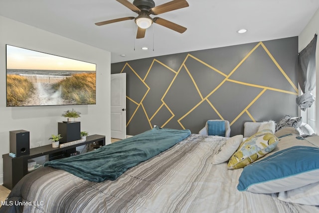 bedroom featuring an accent wall, recessed lighting, and ceiling fan