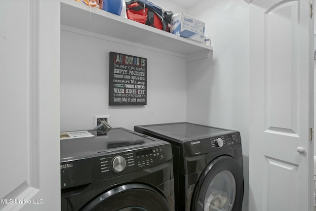 laundry area featuring washing machine and dryer and laundry area