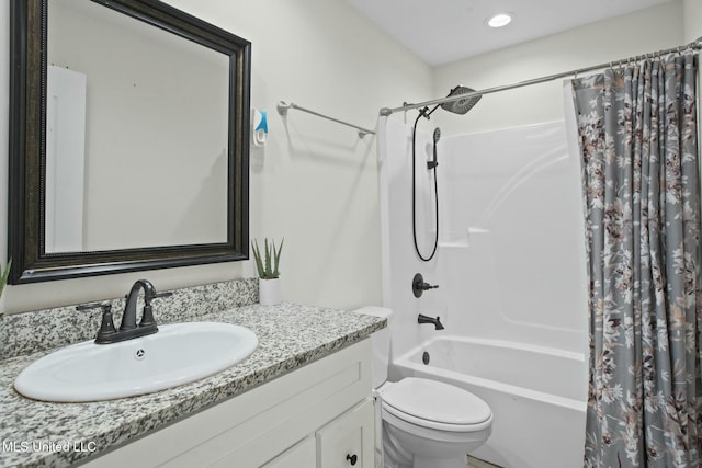 full bathroom with toilet, shower / bath combo, and vanity