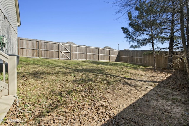 view of yard with a fenced backyard