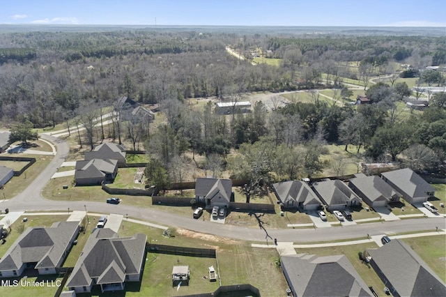birds eye view of property with a wooded view and a residential view