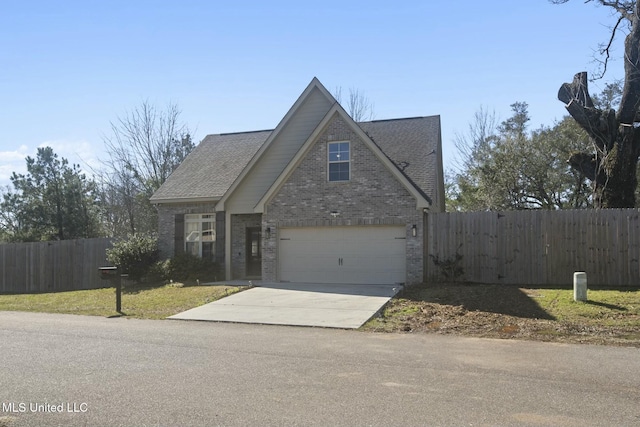 traditional-style home with driveway, brick siding, roof with shingles, and fence
