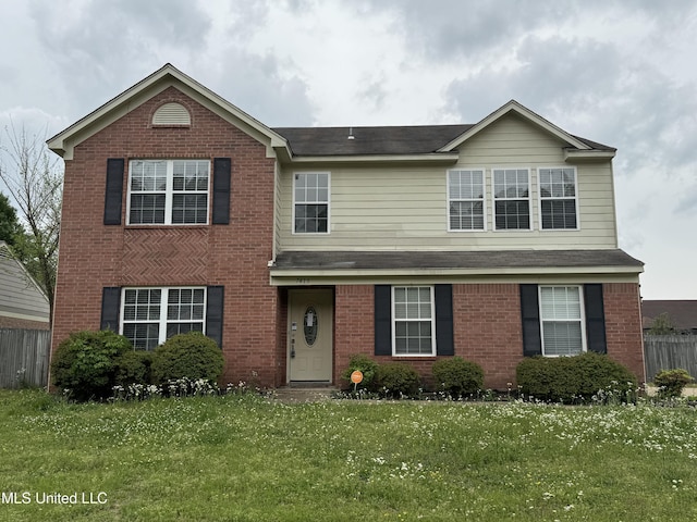 7413 Fox Creek Dr, Olive Branch, MS 38654 - traditional-style home featuring brick siding, fence, and a front yard