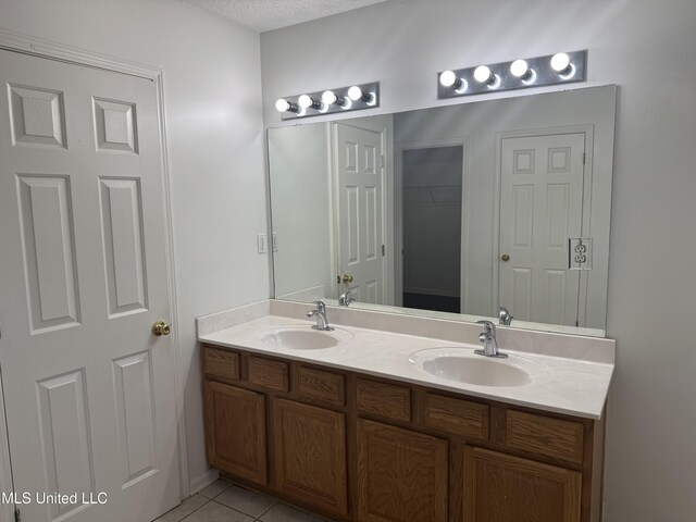 7413 Fox Creek Dr, Olive Branch, MS 38654 - bathroom with double vanity, a sink, and tile patterned flooring