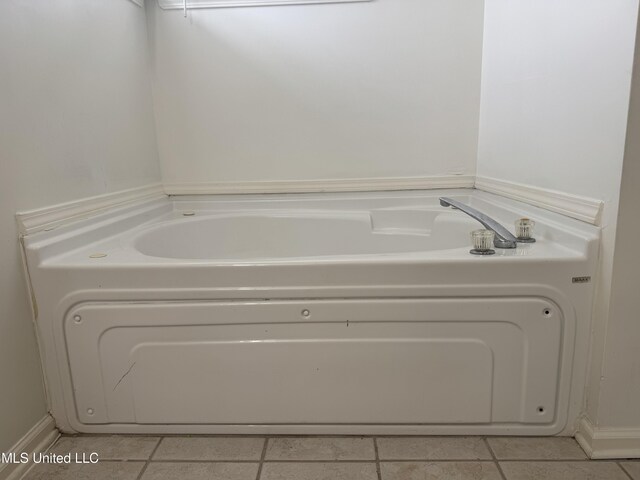 7413 Fox Creek Dr, Olive Branch, MS 38654 - full bath with tile patterned flooring and a garden tub