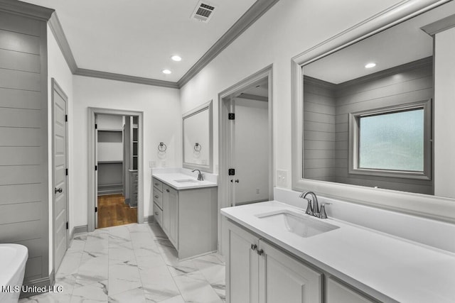 115 Grayson Way, Madison, MS 39110 - full bath with crown molding, marble look tile flooring, two vanities, a soaking tub, and recessed lighting