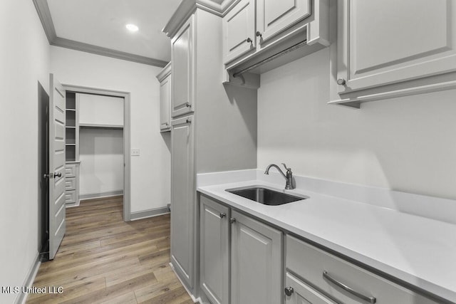 115 Grayson Way, Madison, MS 39110 - washroom with a sink, wood finished floors, ornamental molding, baseboards, and recessed lighting
