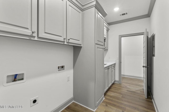 115 Grayson Way, Madison, MS 39110 - clothes washing area with washer hookup, electric dryer hookup, cabinet space, wood finished floors, and baseboards