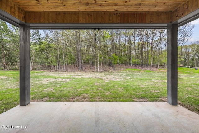 115 Grayson Way, Madison, MS 39110 - view of grassy yard with a patio and a forest view