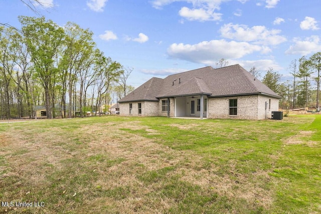 115 Grayson Way, Madison, MS 39110 - back of house featuring central AC unit, a patio area, a yard, and brick siding