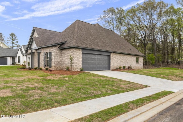 115 Grayson Way, Madison, MS 39110 - view of home's exterior featuring a shingled roof, an attached garage, brick siding, a lawn, and driveway