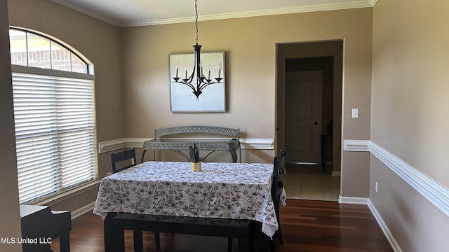 14291 Buttercup Dr, Olive Branch, MS 38654 - dining space featuring a chandelier, healthy amount of natural light, dark wood finished floors, and crown molding