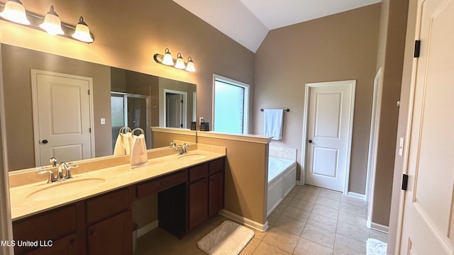 14291 Buttercup Dr, Olive Branch, MS 38654 - full bath featuring lofted ceiling, a shower stall, double vanity, a garden tub, and tile patterned floors