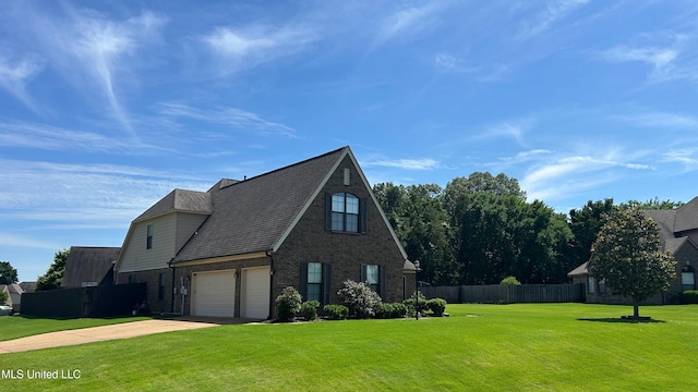 14291 Buttercup Dr, Olive Branch, MS 38654 - view of home's exterior featuring brick siding, concrete driveway, and a garage