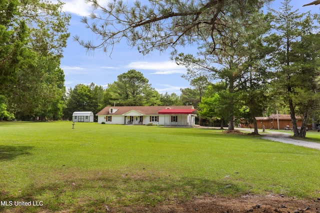 156 Cobbville Rd, Canton, MS 39046 - view of front facade with a front lawn and view of scattered trees