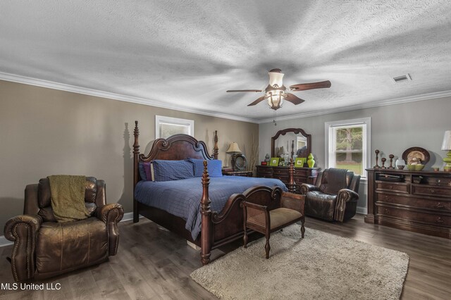 156 Cobbville Rd, Canton, MS 39046 - bedroom featuring multiple windows, a textured ceiling, wood finished floors, ornamental molding, and a ceiling fan