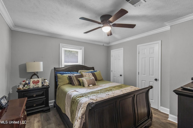 156 Cobbville Rd, Canton, MS 39046 - bedroom featuring dark wood-style flooring, a textured ceiling, crown molding, and a ceiling fan