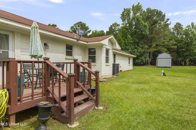 156 Cobbville Rd, Canton, MS 39046 - view of grassy yard featuring a storage unit and a deck