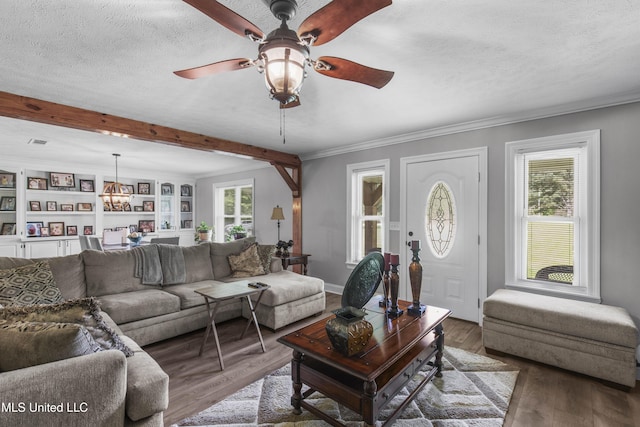 156 Cobbville Rd, Canton, MS 39046 - living area featuring wood finished floors, ceiling fan, beamed ceiling, crown molding, and a textured ceiling