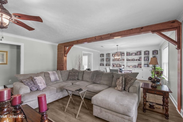156 Cobbville Rd, Canton, MS 39046 - living area featuring wood finished floors, ceiling fan, beam ceiling, ornamental molding, and a chandelier