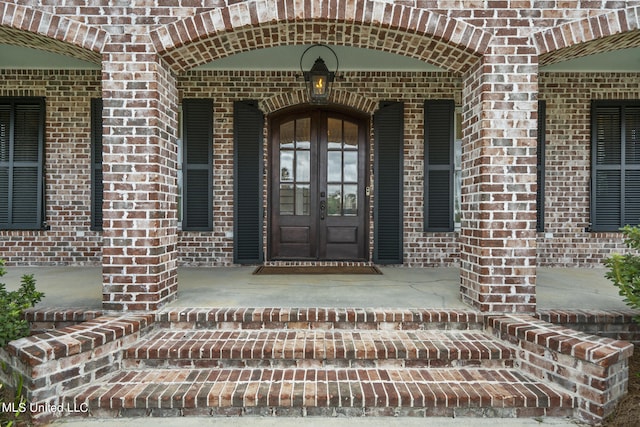 property entrance featuring french doors