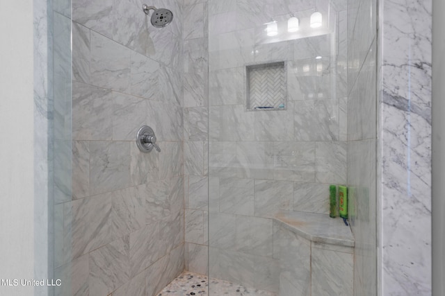 bathroom featuring tiled shower