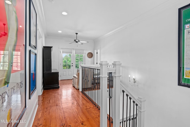 corridor with crown molding and wood-type flooring