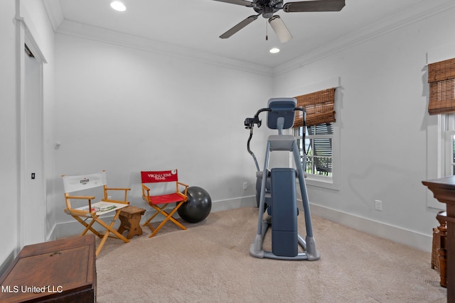 exercise room with light carpet, ornamental molding, and ceiling fan