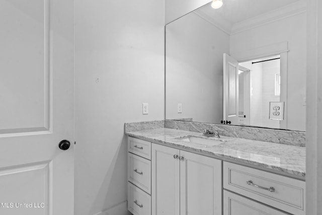 bathroom featuring vanity and crown molding