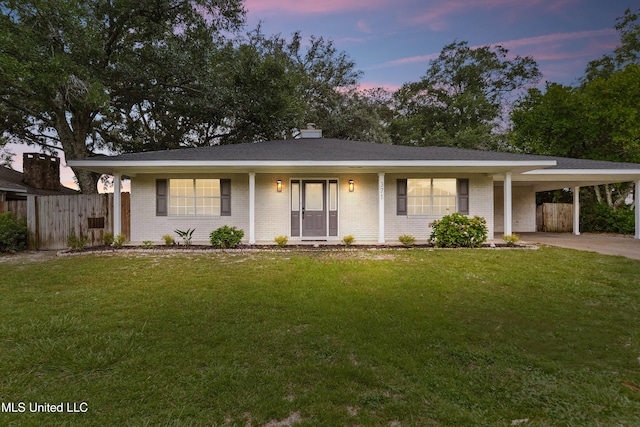 371 Lakeview Blvd, Biloxi, MS 39531 - ranch-style house with brick siding, an attached carport, concrete driveway, and a chimney