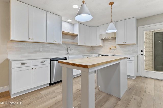 371 Lakeview Blvd, Biloxi, MS 39531 - kitchen with wooden counters, stainless steel dishwasher, open shelves, light wood-type flooring, and white cabinetry
