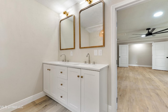 371 Lakeview Blvd, Biloxi, MS 39531 - bathroom featuring double vanity, wood finished floors, a ceiling fan, and recessed lighting