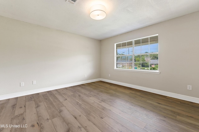 371 Lakeview Blvd, Biloxi, MS 39531 - spare room featuring baseboards and hardwood / wood-style flooring