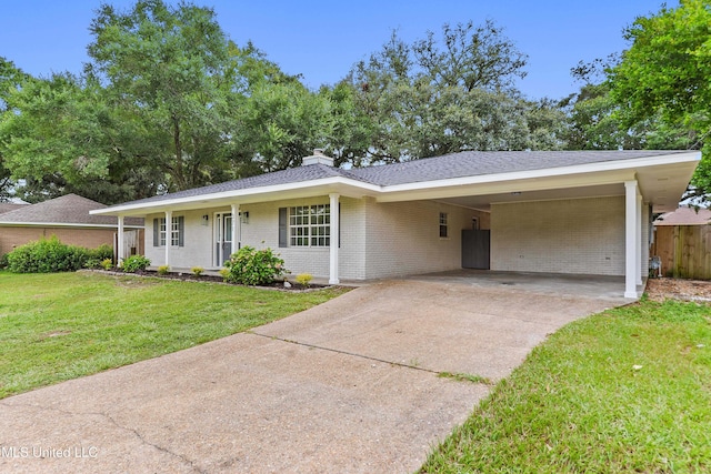 371 Lakeview Blvd, Biloxi, MS 39531 - single story home featuring driveway, brick siding, a carport, a chimney, and a shingled roof