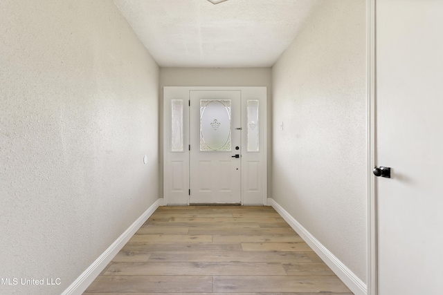 371 Lakeview Blvd, Biloxi, MS 39531 - doorway to outside with light wood-style floors and a textured wall