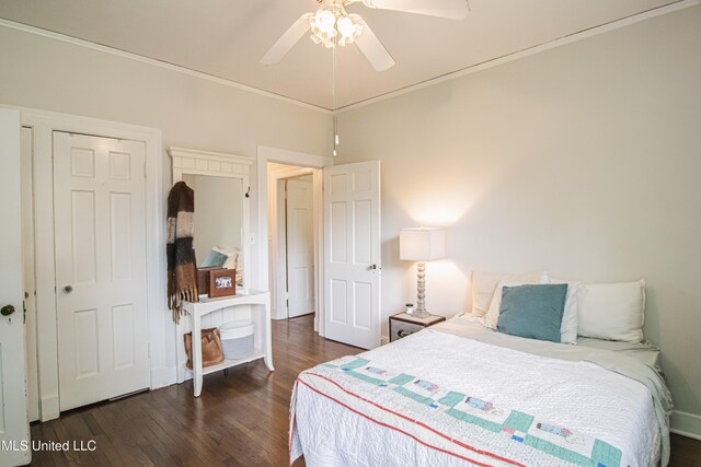 bedroom featuring ceiling fan, dark wood finished floors, and ornamental molding