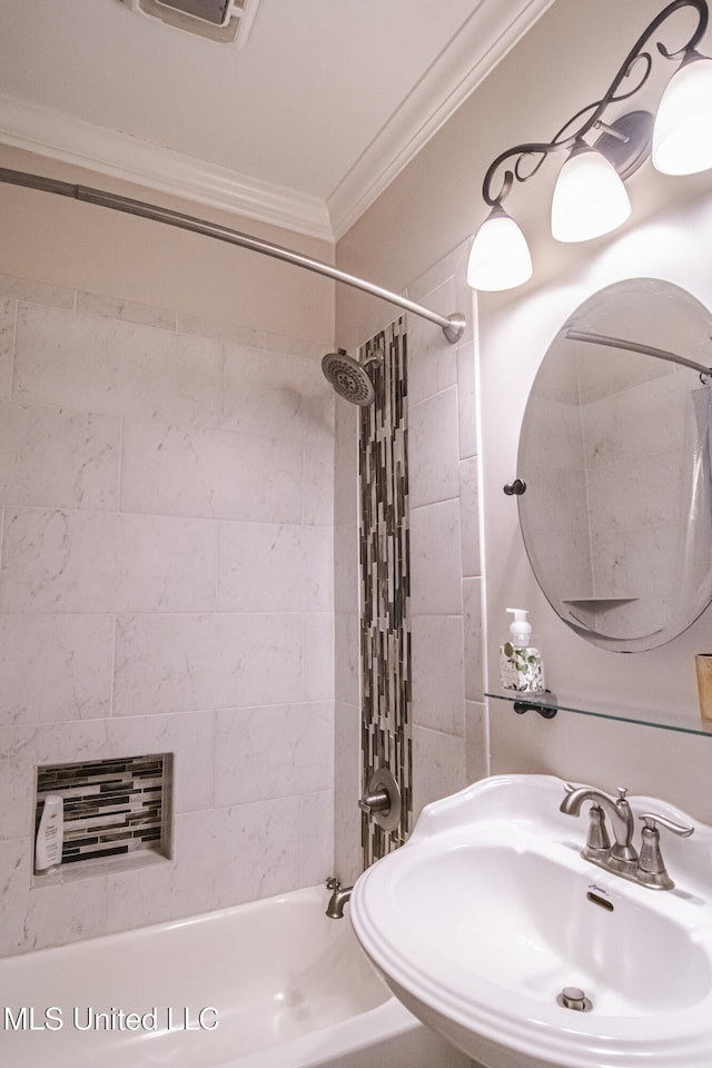 full bath featuring  shower combination, ornamental molding, and a sink