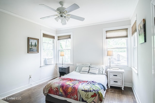 bedroom featuring baseboards, ornamental molding, a ceiling fan, and wood finished floors