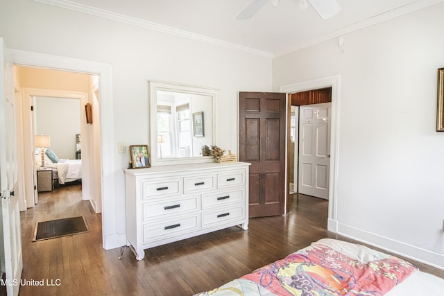 bedroom featuring baseboards, ornamental molding, a ceiling fan, and dark wood-type flooring