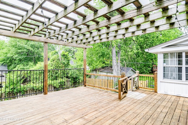 wooden deck featuring a pergola