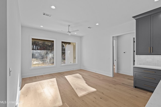 interior space with recessed lighting, baseboards, visible vents, and light wood finished floors