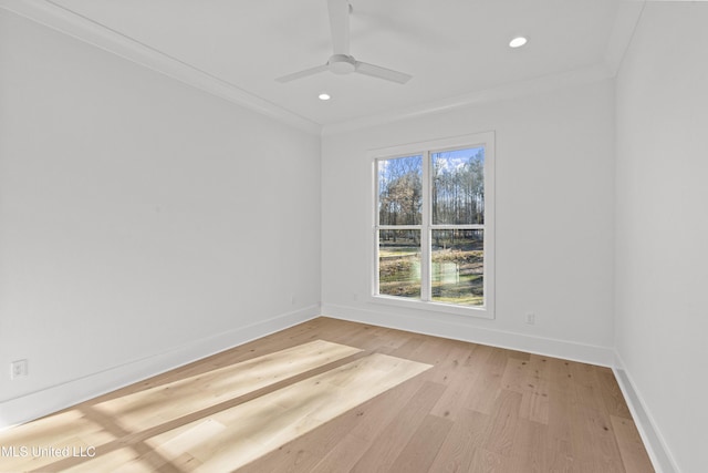 unfurnished room featuring light wood-style flooring, baseboards, crown molding, and recessed lighting