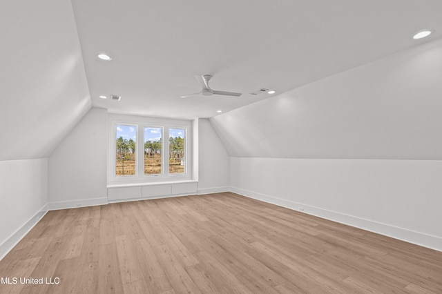 bonus room featuring baseboards, ceiling fan, light wood-style flooring, vaulted ceiling, and recessed lighting