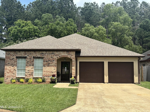 420 Stoneybrook Dr, Brandon, MS 39042 - view of front of home with a shingled roof, concrete driveway, an attached garage, a front yard, and brick siding