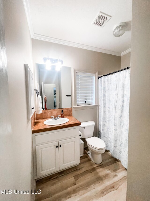 420 Stoneybrook Dr, Brandon, MS 39042 - full bath with ornamental molding, wood finished floors, vanity, and a shower with curtain