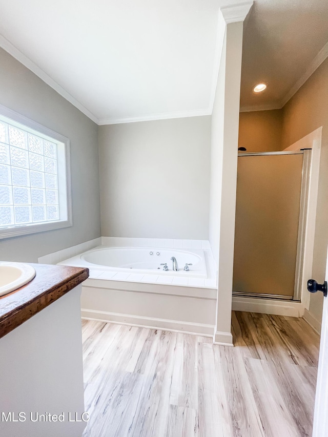 420 Stoneybrook Dr, Brandon, MS 39042 - bathroom with crown molding, a bath, vanity, a shower stall, and wood finished floors