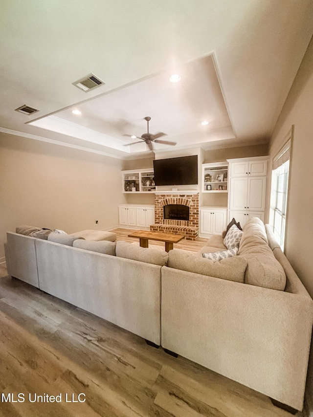 420 Stoneybrook Dr, Brandon, MS 39042 - living area featuring a raised ceiling, ceiling fan, light wood-style flooring, and recessed lighting